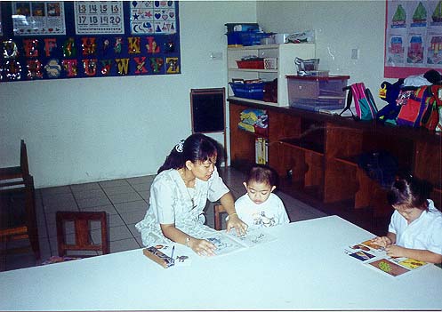 Mohd Syahwan with teacher Sundai during Pre-reading lesson.